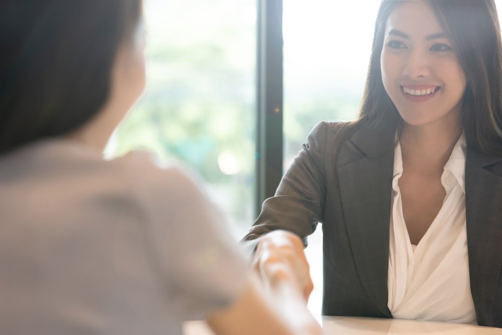 handshake (c) iStock-pondsaksit.jpg