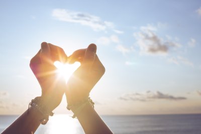 heart with hands at beach