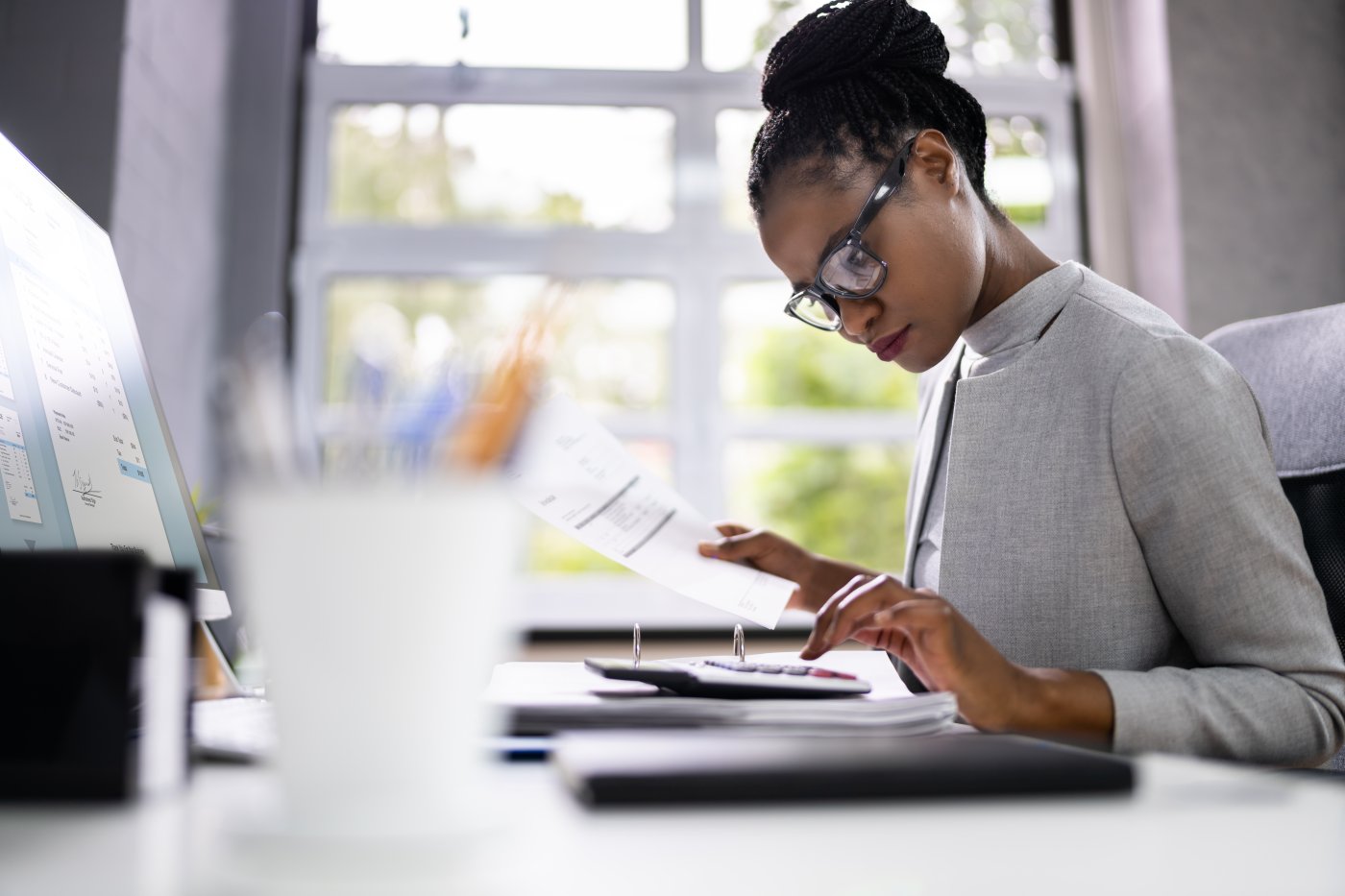 Female sitting in front of her desk looking at a beautiful seaturtle image