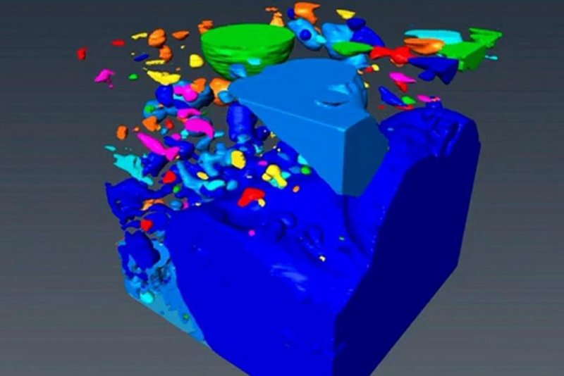 A cube-shaped sample of pumice (blue-gray) and pockets of trapped gases (other colors) - see also Video (link at end of text)
(c) Berkeley Lab, UC Berkeley