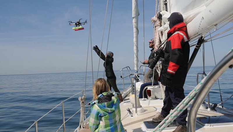 The research team launches a drone during field work in Cape Cod Bay.
(c) Véroniqe LaCapra, WHOI