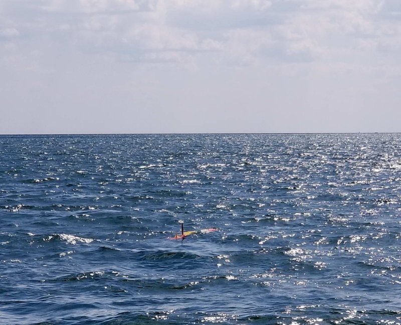 A long-range AUV heads out into the open waters of Lake Erie to monitor harmful algae blooms and microcystin toxin concentrations. (c) NOAA