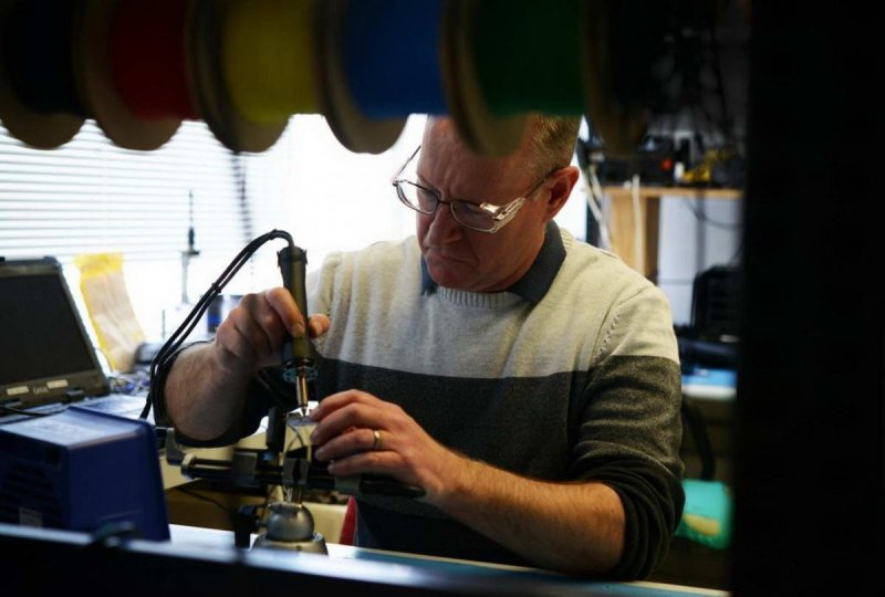 Tim Lamb, technician of the Australian Antarctic Division, works on a UW camera (c) Jessica Fitzpatrick