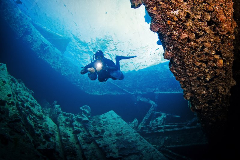 Divers exploring the SS Thistlegorm wreck in Egypt’s Red Sea